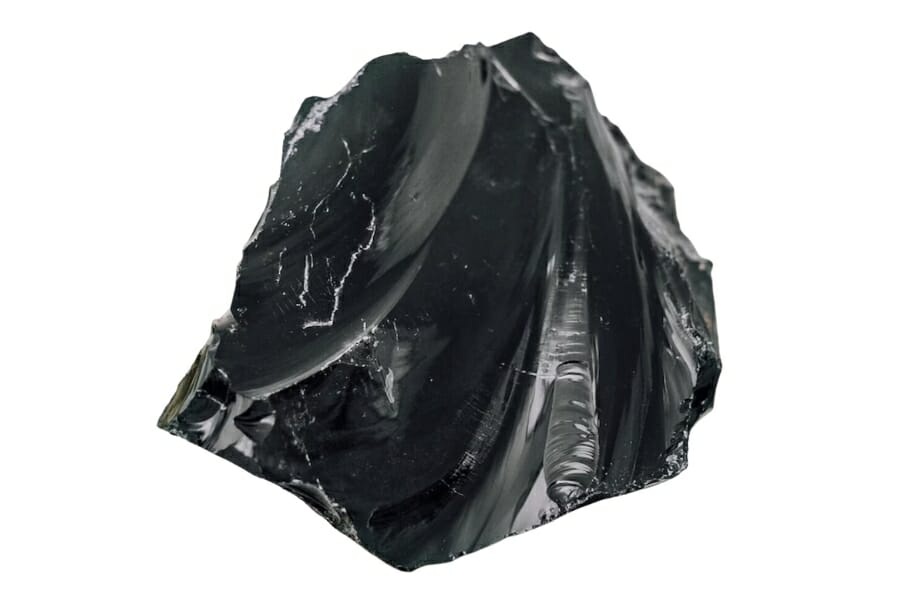 A beautiful black obsidian with a unique curved and smooth surface 