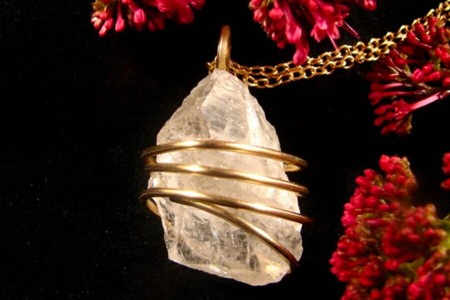 A stunning gold pendant with raw Orthoclase