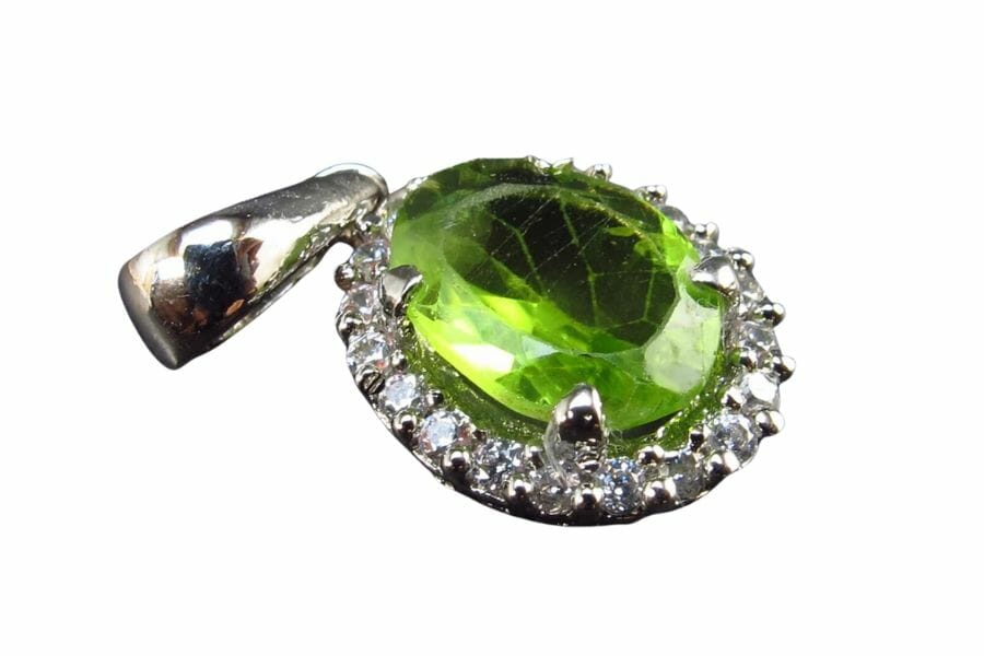 A big olivine pendant surrounded by diamond studs