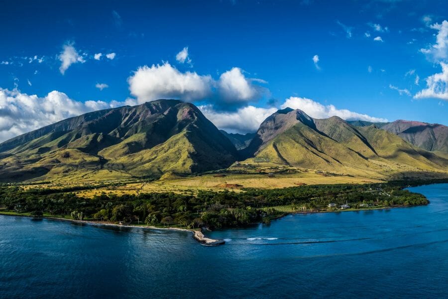 A painting-like photo of the Olowalu Valley which contains various mineral and rock specimens