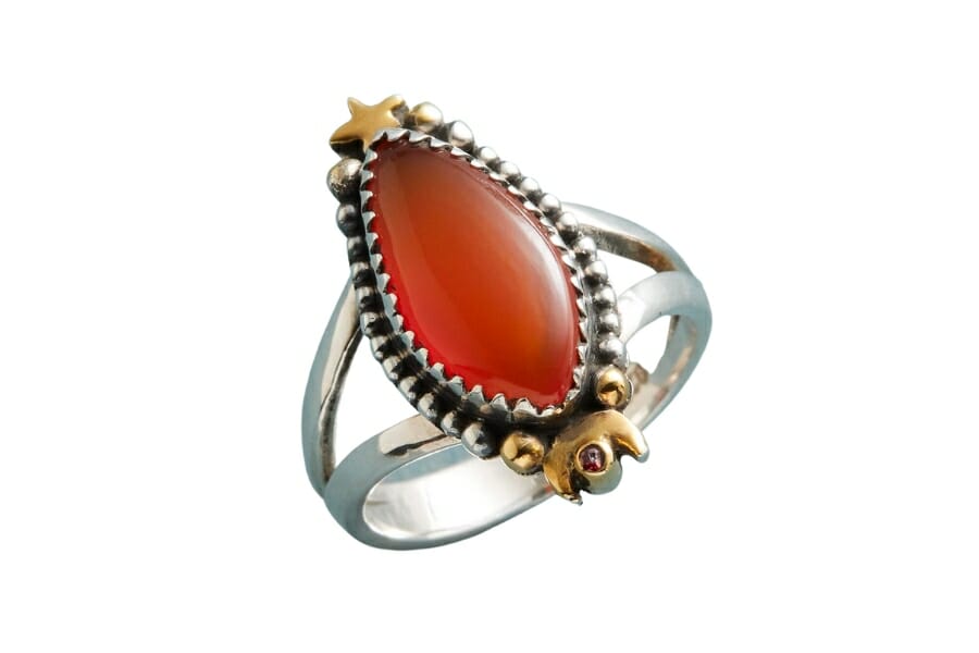 Silver and gold ring with an oval Orange Carnelian
