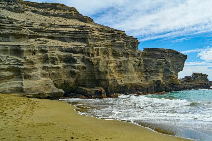 A unique Papakolea Beach with its green sands and amazing rock formations