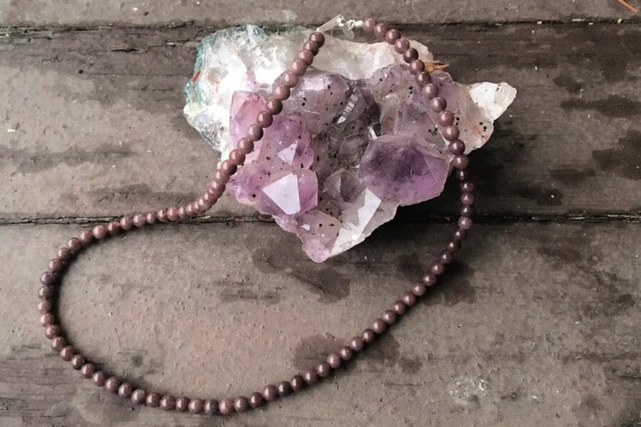 A beautiful raw purple aventurine crystal made into a necklace 