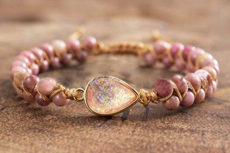 A gorgeous pink rhodonite beaded bracelet with gold rope accents