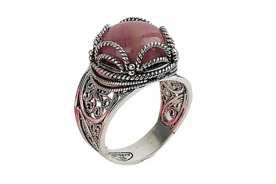 An elegant rhodonite silver ring with beautiful intricate details