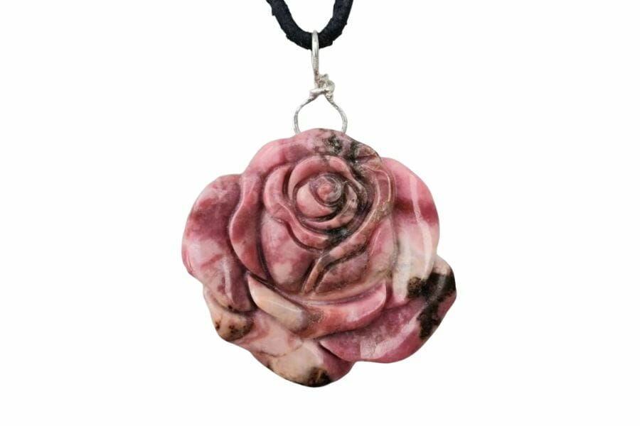 A mesmerizing handcrafted flower-shaped rhodonite pendant