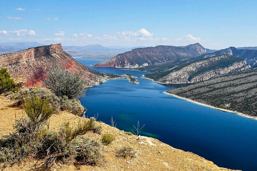 Aerial view of a reservoir and its surrounding landscapes in Rock Springs 