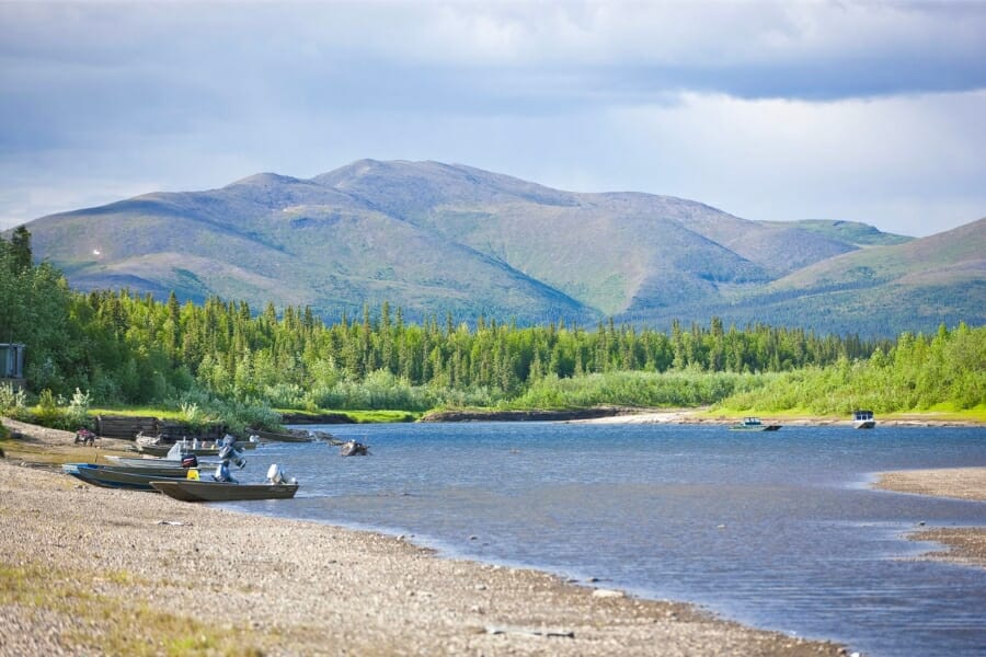 Serene view of Shungnak showing its mountainous region, forest, and waters