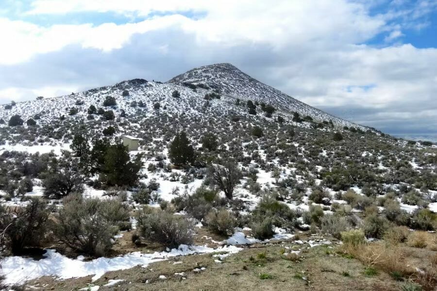 Snowy mountain sides of the Sugarloaf Peak where rocks and minerals are located