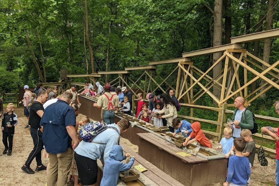 Kids with their parents rockhounding for different rock and mineral specimens at the Ol Susquehanna Mine