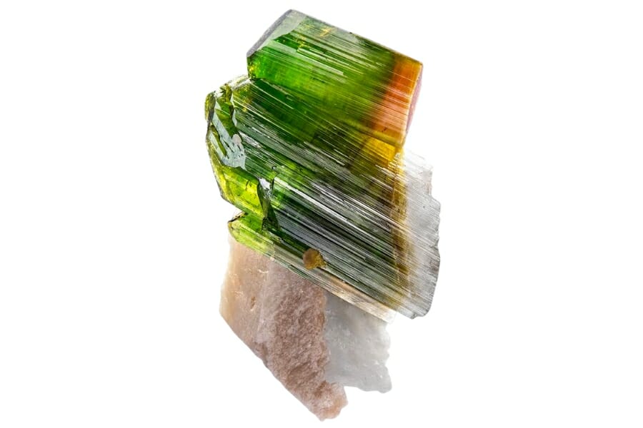 A Tourmaline specimen with colors from green to yellow and orange