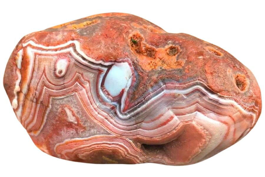 A huge sample of Lake Superior Agate showing interesting patterns in orange, red, white, and brown hues