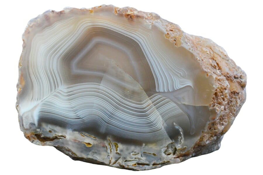 Agate with white banding over grayish to brown surface