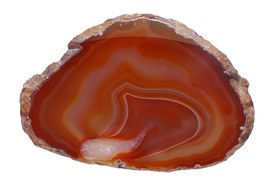 A stunning agate geode with bright orange hues