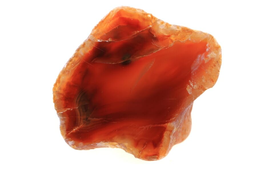 A stunning bright red agate with a unique shape