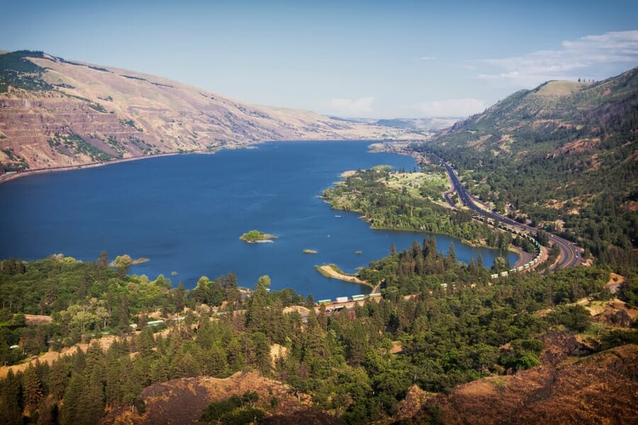 A beautiful aerial view of the Columbia River featuring the hillsides and mountains beside it