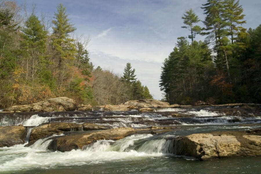 Water rushing through the Coosa River where petrified wood can be found.