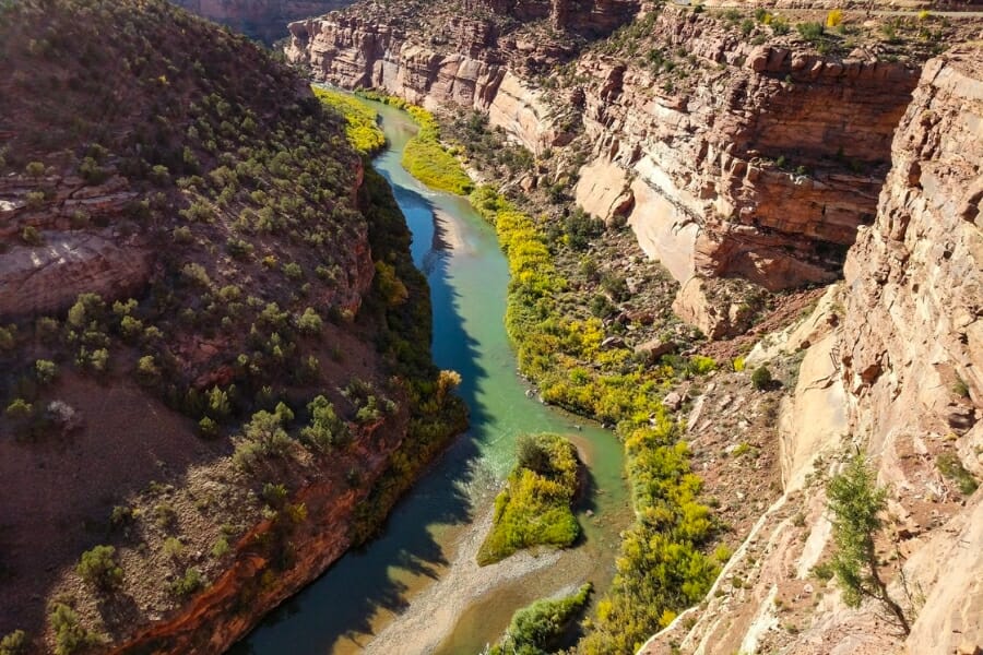 Aerial view of the long stretch of Dolores River and its amazing surrounding rock formations and landscapes