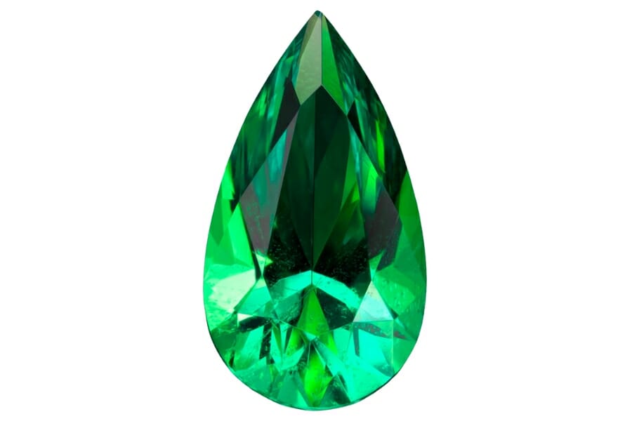 A lustrous, polished, deep green Emerald