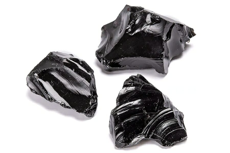 Three samples of glass-like shiny black Obsidians