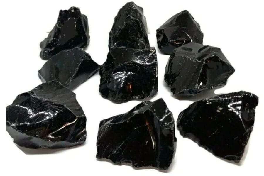 A bunch of shiny, black Obsidian specimens
