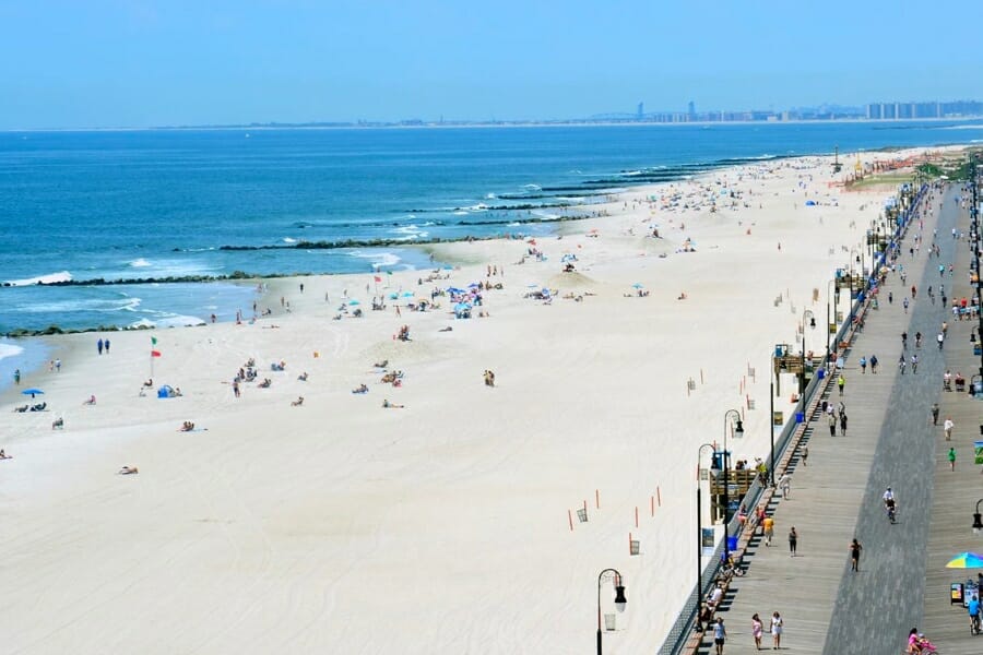 Aerial view of the wide stretch of white beach sands and the ocean at Ocean Park 