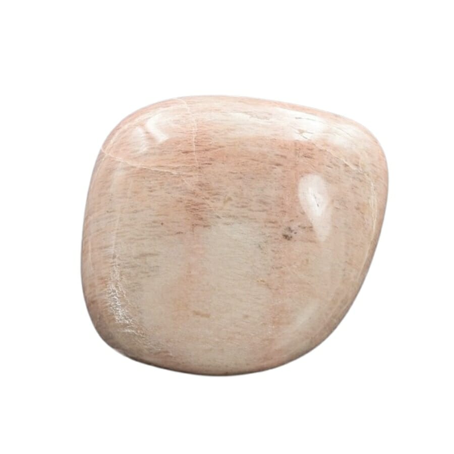 A pretty pink moonstone with streaks of brown hues