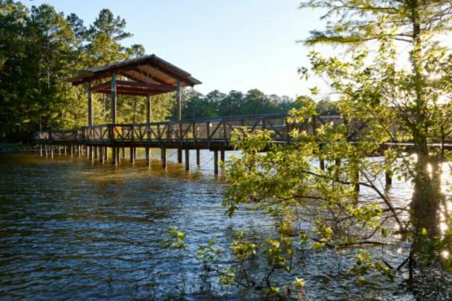 The Toledo Bend Reservoir flowing under the bridge with a small hut