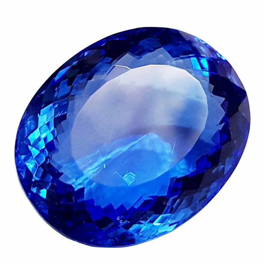 piece of loose oval cut deep blue topaz gem