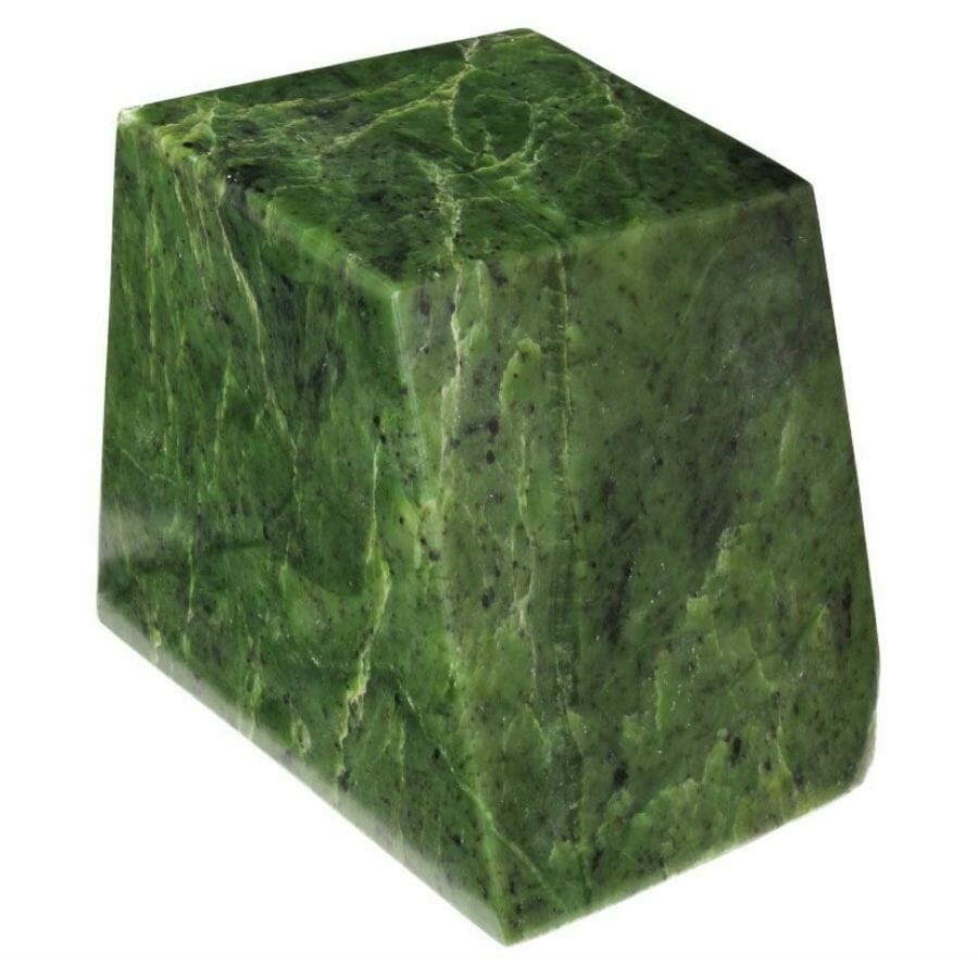 a block of green jade with black specks