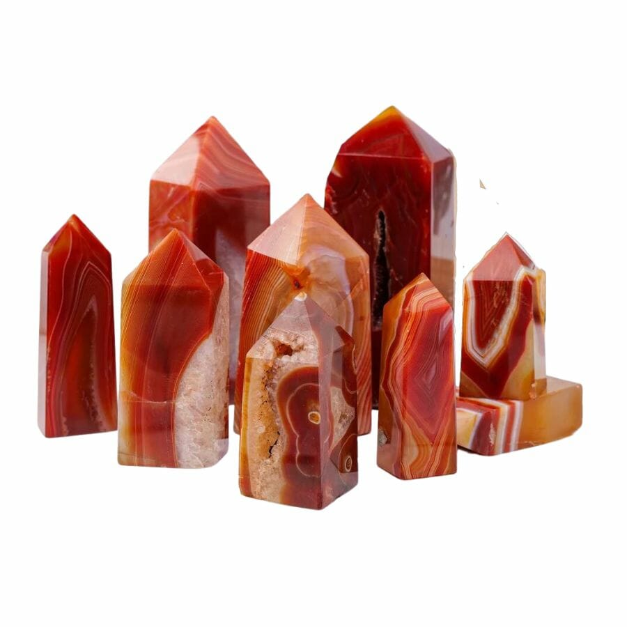 group of red agate obelisks showing red, orange, brown, and white banding