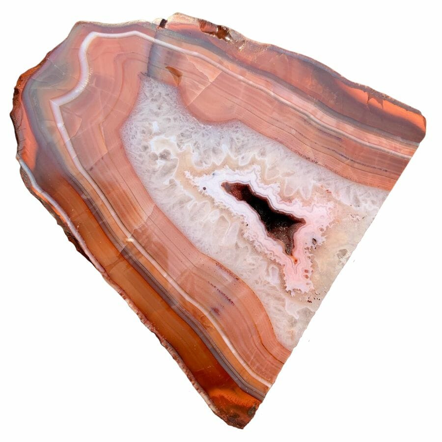 red agate slab showing bands in red, brown, orange, and white
