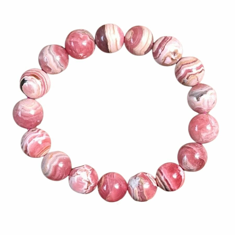 a bracelet with pink rhodochrosite beads