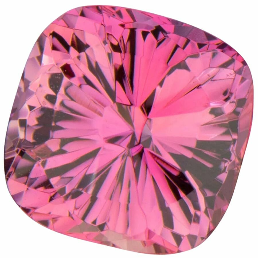 a piece of concave cut pink sapphire