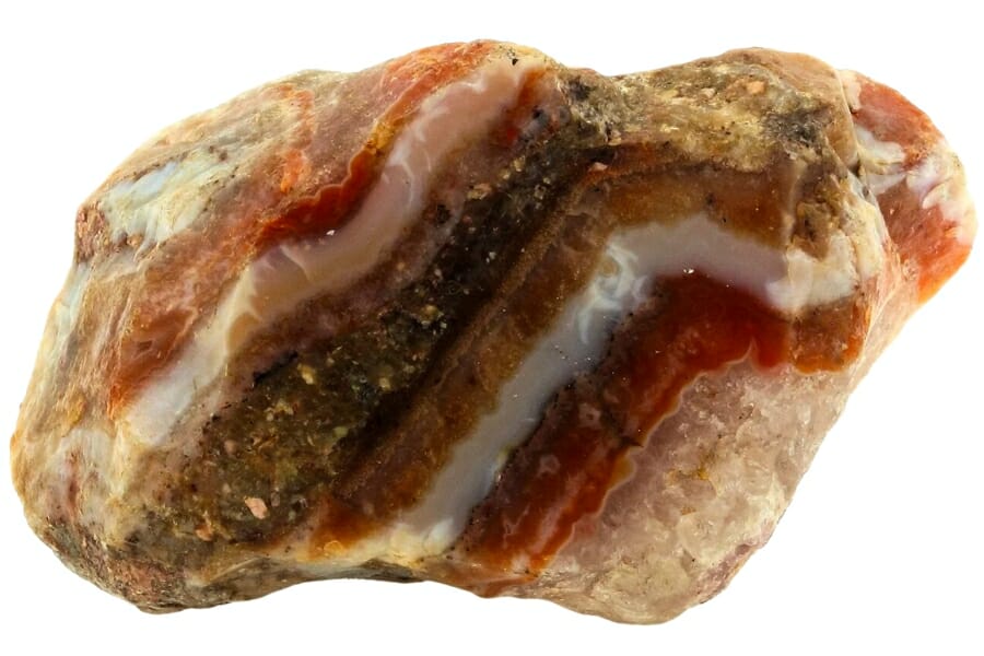 Close up look at an agate with amazing bands of red, white, brown, and bronze