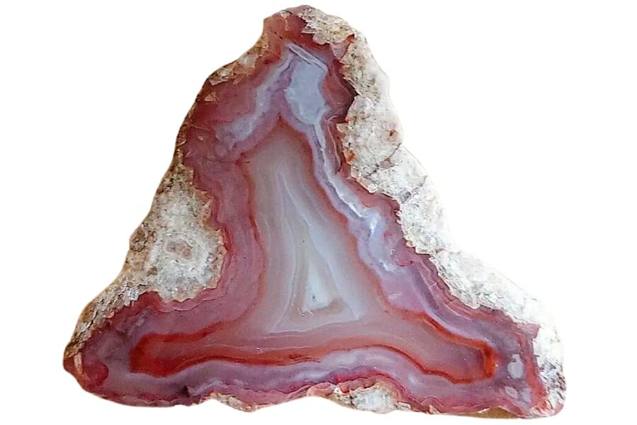 Close-up look at the interesting red, white, and pink banding patterns of an agate