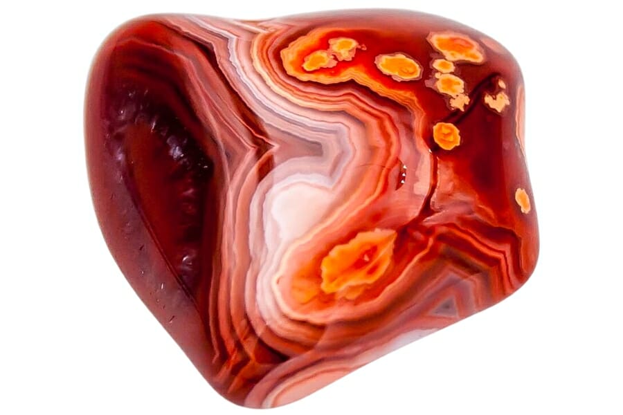 A pretty red Lake Superior agate with amazing bands and swirls of white, red, orange, and yellow