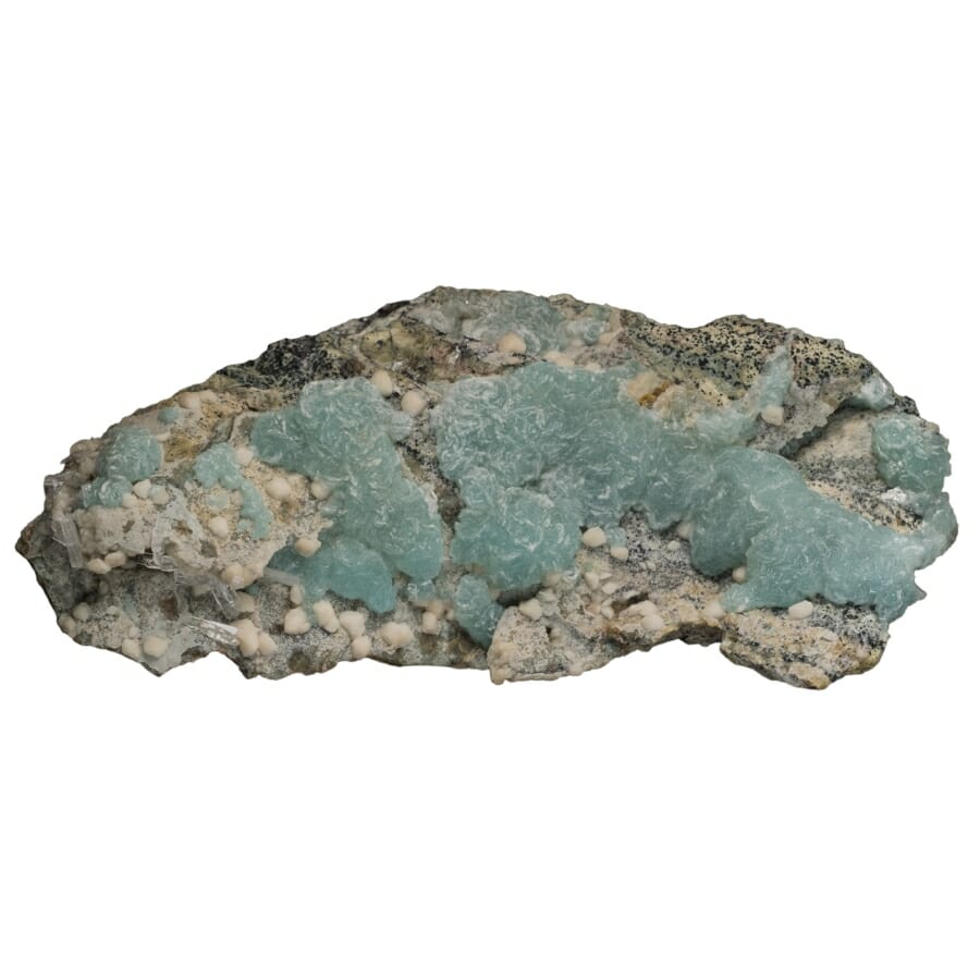 An oblong-shaped mineral decorated with blue brucite crystals 