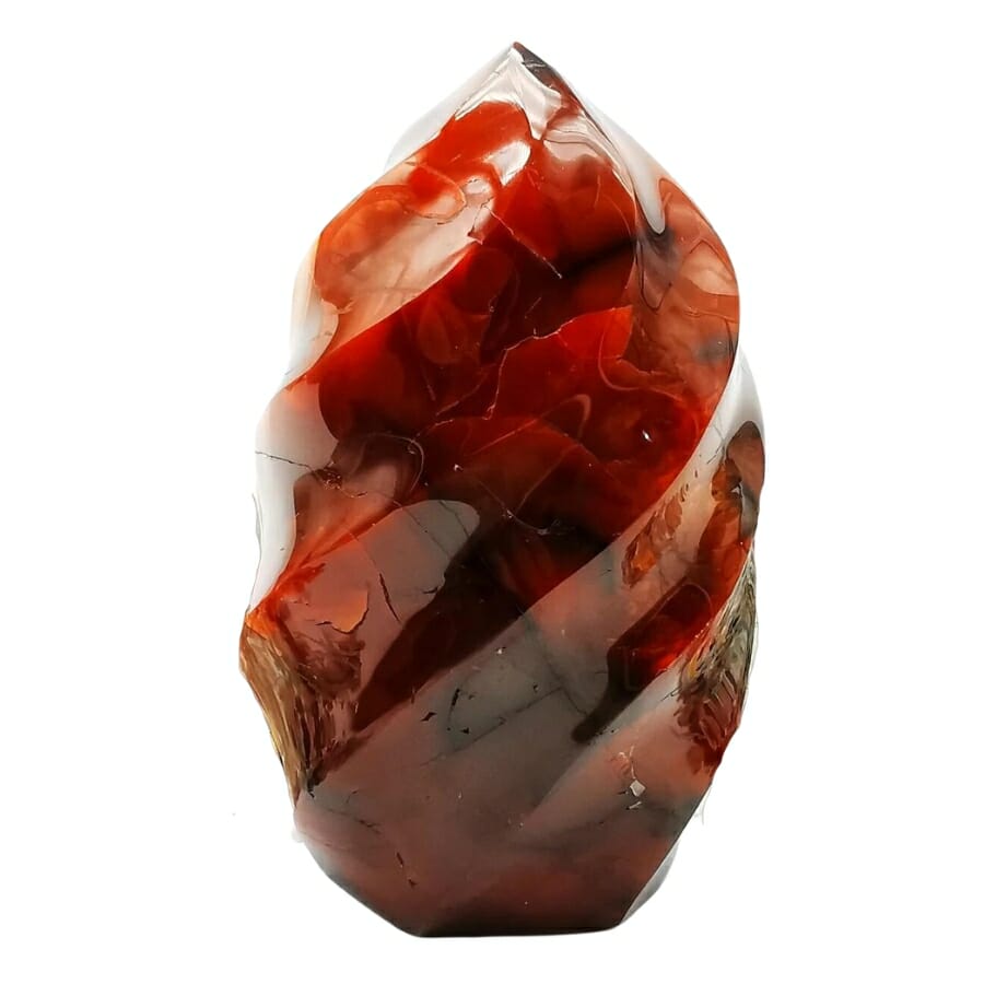 A gorgeous carnelian crystal flame tower with different red and orange hues
