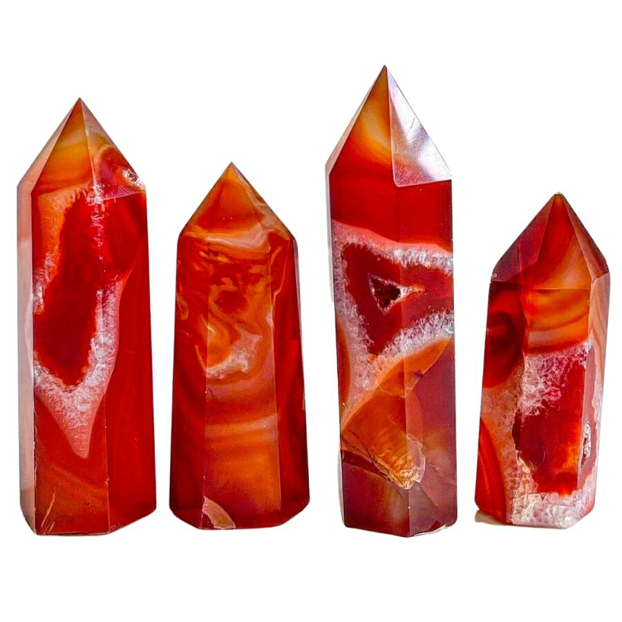 Four towers of red carnelian with interesting white and orange details