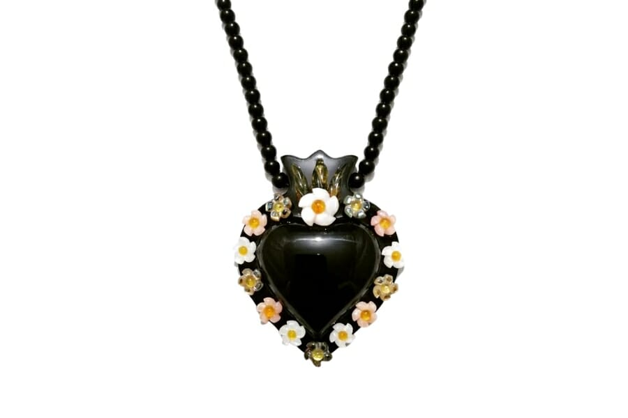 A dainty heart-shaped obsidian necklace pendant