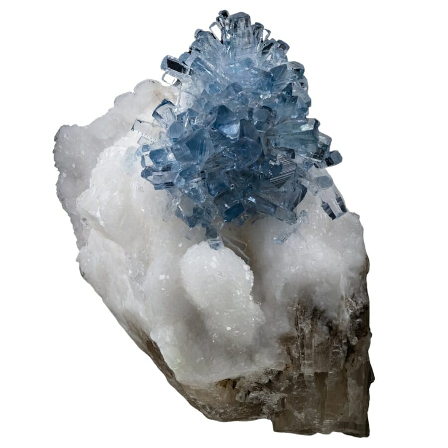 An ethereal blue celestite cluster sitting on a white snow mineral