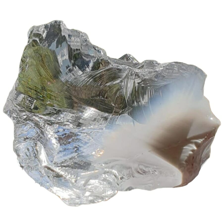 Clear white translucent Andara crystal with a brown spot on its bottom right corner