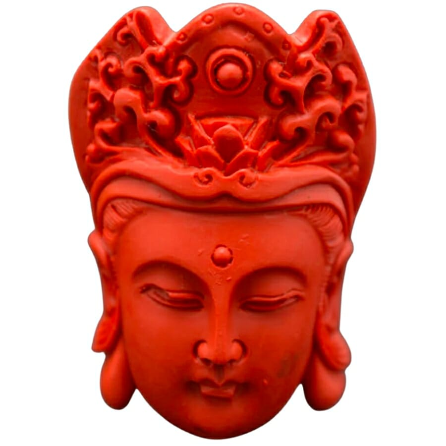 Buddha headstone pendant carved out of cinnabar
