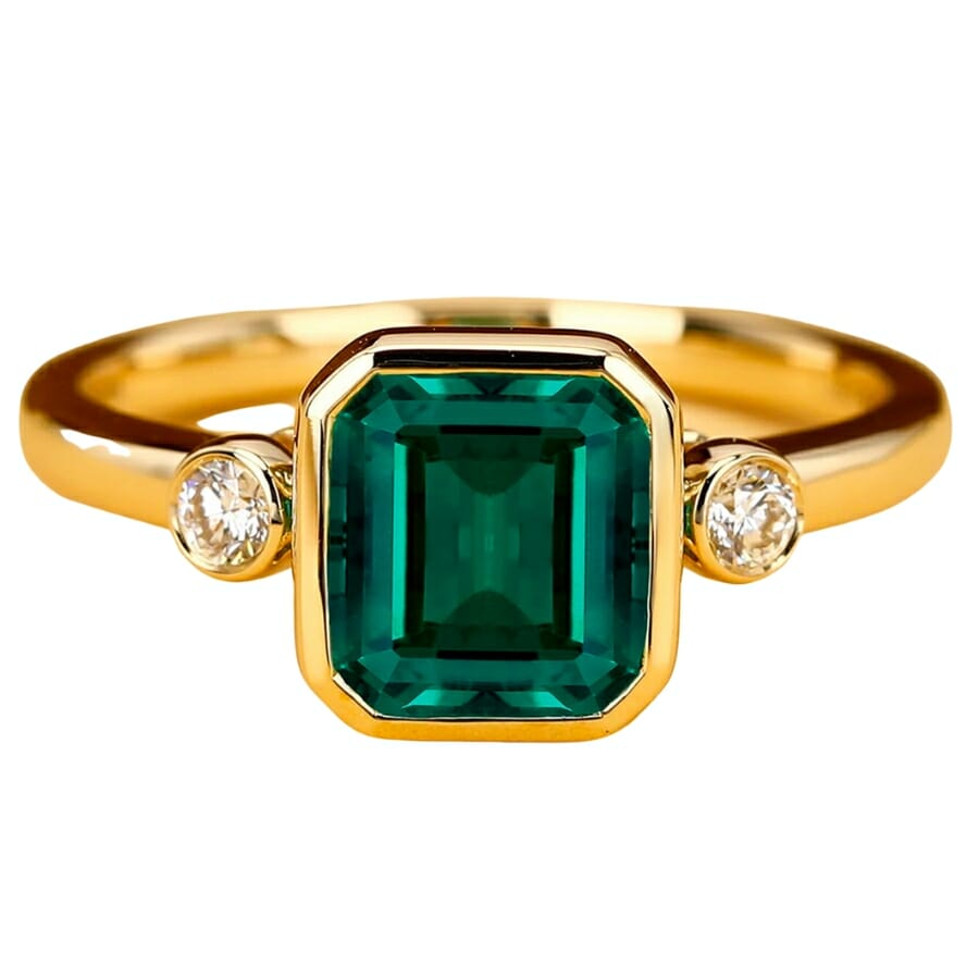 Stunning golden ring with a deep forest-green emerald