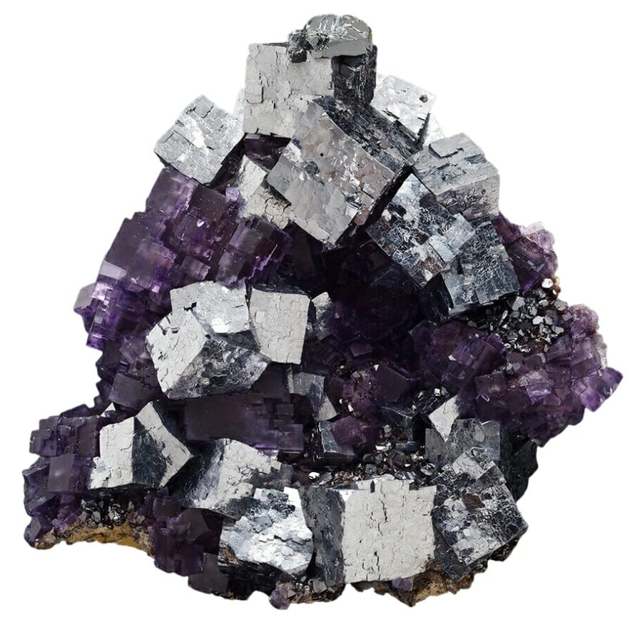 An illuminating galena crystal with purple fluorite