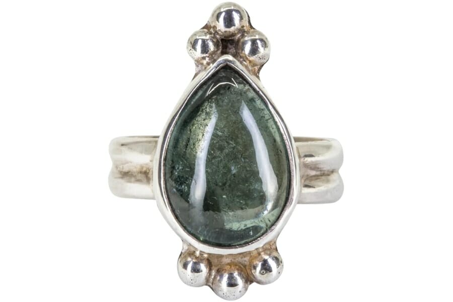 An elegant and expensive green tourmaline pear shaped handcrafted silver ring 