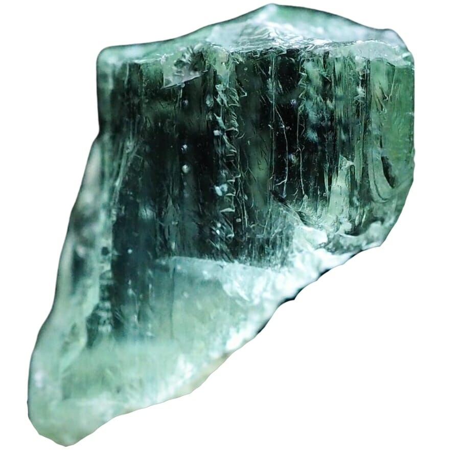 A beautiful hiddenite crystal with a distinct green structure