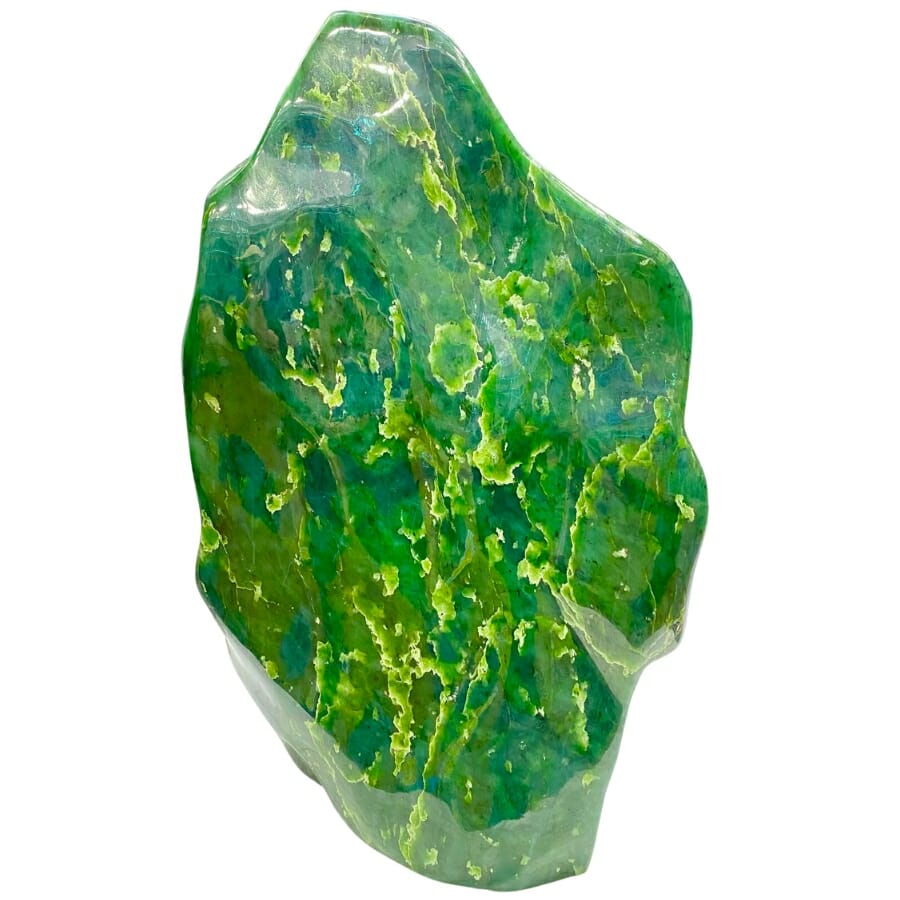 Big block of a vivid green Nephrite with details of yellow and white