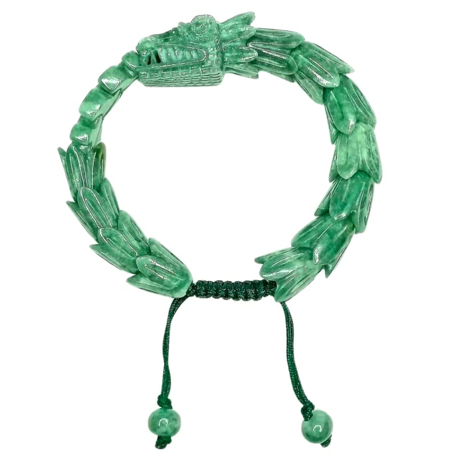 Intricately-carved light green Jade bracelet